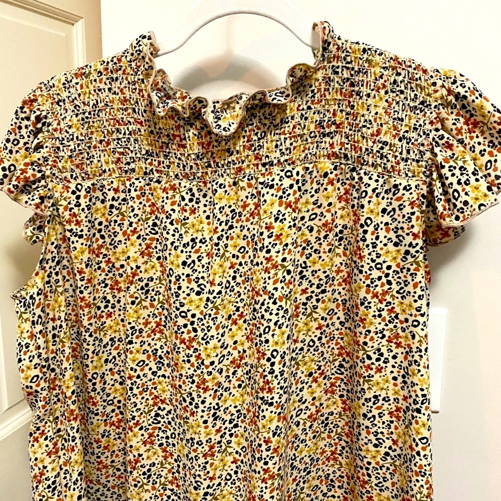 Great blouse with flutter sleeves- size L - new without tags. Never worn